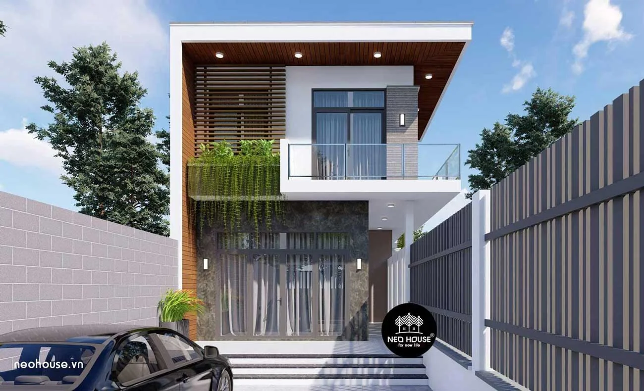 Mẫu nhà ống 2 tầng hiện đại với thiết kế mặt tiền ấn tượng và ban công kính.